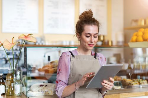 Business owner reviewing business energy prices.