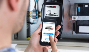 man reading energy meter.